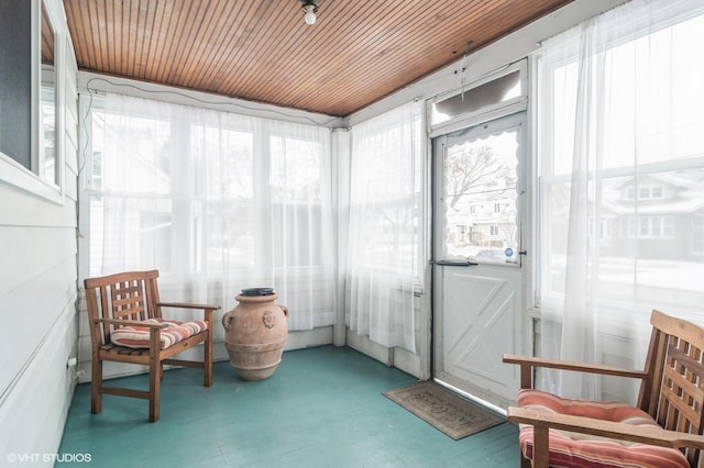 sunroom / solarium featuring wood ceiling