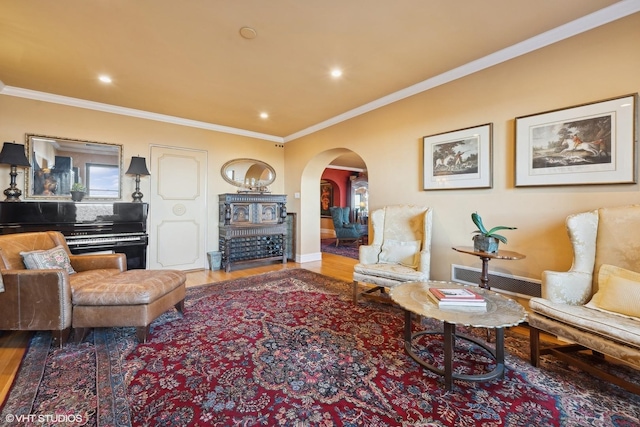 living room with hardwood / wood-style flooring and ornamental molding