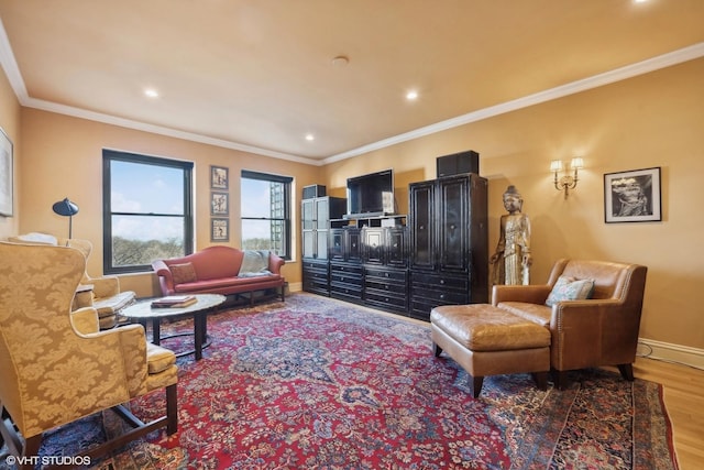 living room featuring crown molding and hardwood / wood-style flooring