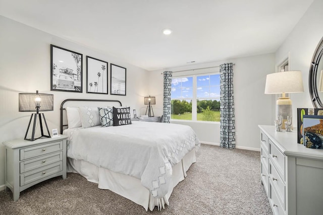 bedroom with light carpet