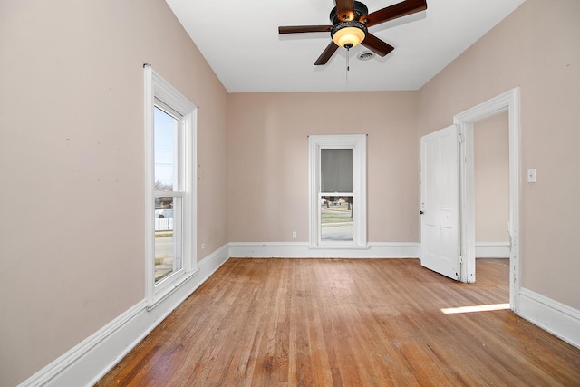 spare room with ceiling fan and light hardwood / wood-style floors