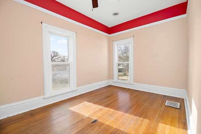 empty room featuring ceiling fan and hardwood / wood-style flooring