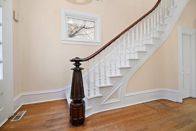 staircase featuring hardwood / wood-style flooring