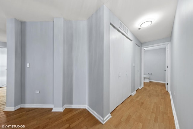 corridor featuring light hardwood / wood-style floors