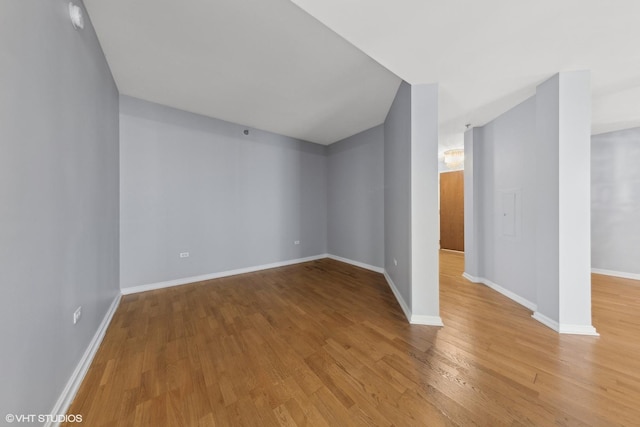 additional living space featuring wood-type flooring