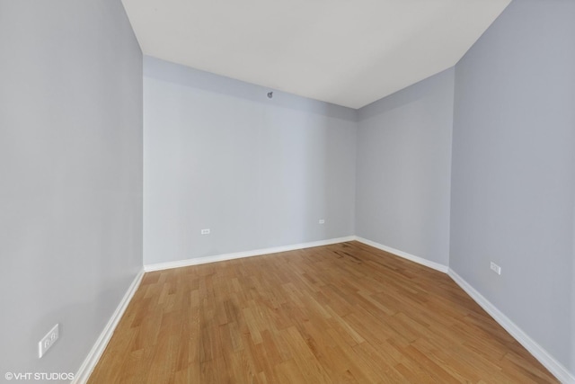 spare room with light hardwood / wood-style flooring