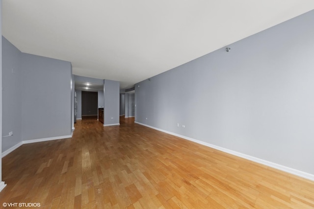 unfurnished living room featuring hardwood / wood-style floors