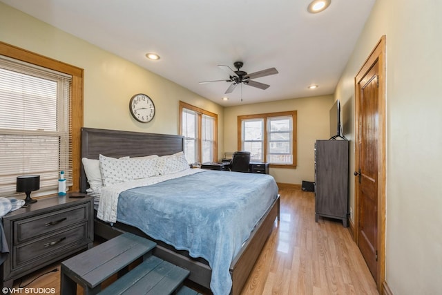 bedroom with ceiling fan and light hardwood / wood-style flooring