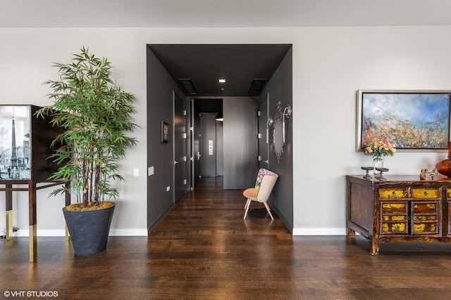 corridor with dark hardwood / wood-style floors