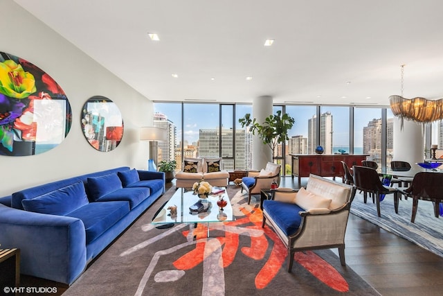 living room with expansive windows, dark wood-type flooring, and a notable chandelier