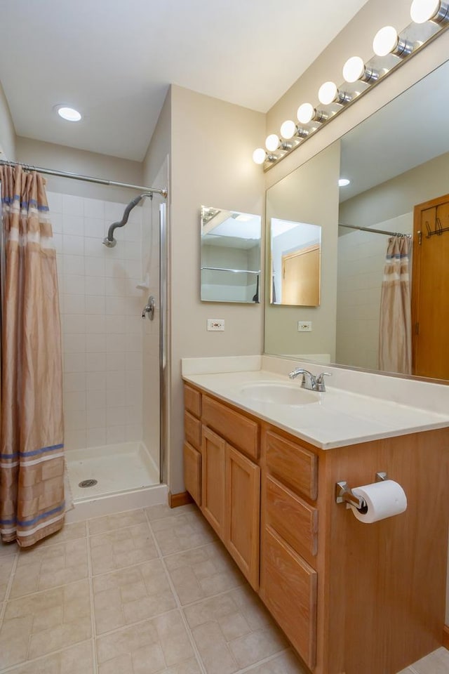 bathroom with vanity and walk in shower