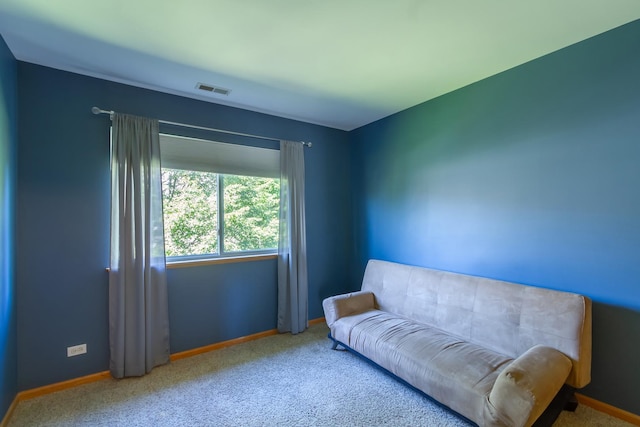 sitting room featuring carpet floors