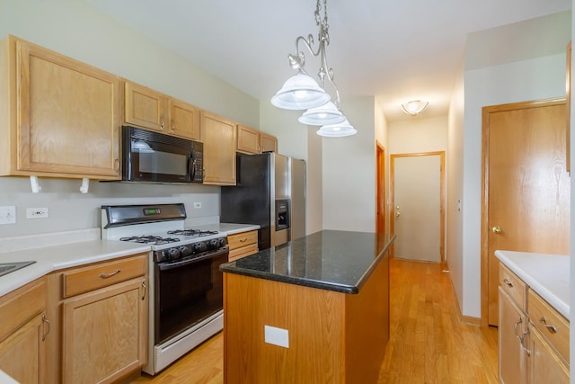 kitchen with stainless steel refrigerator with ice dispenser, light wood-type flooring, pendant lighting, white range with gas stovetop, and a kitchen island