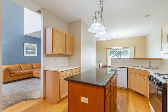 kitchen featuring light wood-type flooring, white appliances, pendant lighting, an inviting chandelier, and a kitchen island