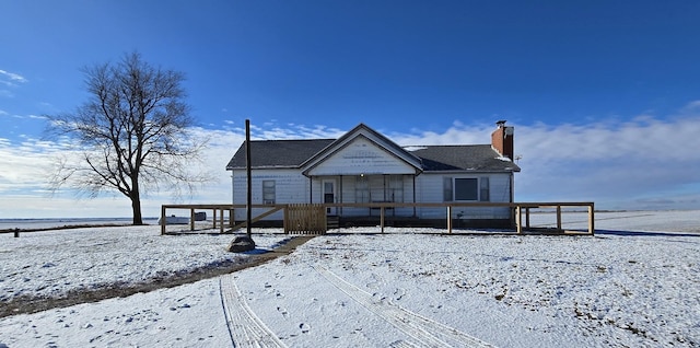 view of snow covered house