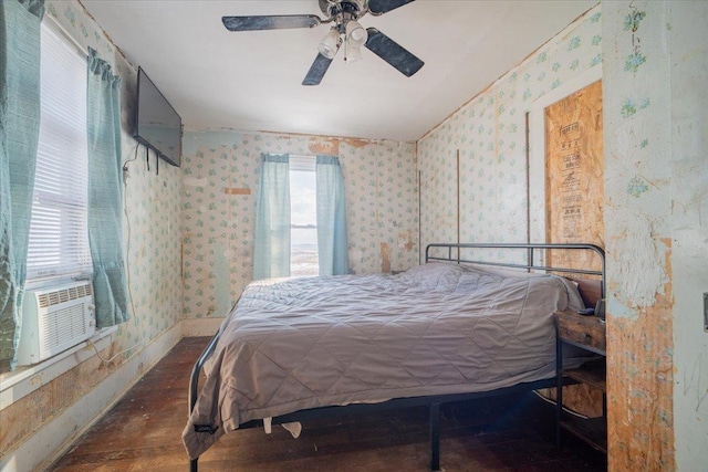 bedroom featuring ceiling fan, cooling unit, and dark hardwood / wood-style floors