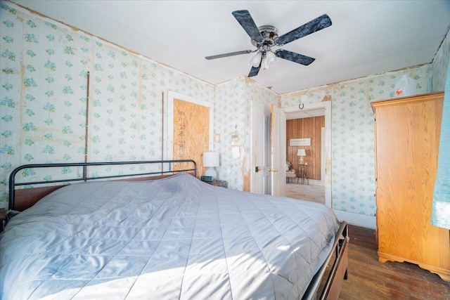 bedroom featuring ceiling fan and dark wood-type flooring