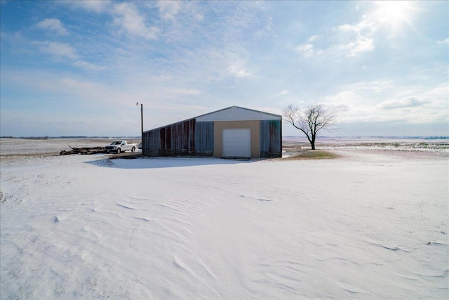 view of outdoor structure featuring a garage and a water view