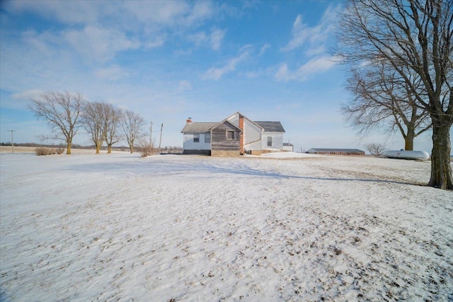 view of snow covered property