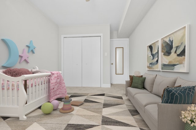 carpeted bedroom featuring a closet