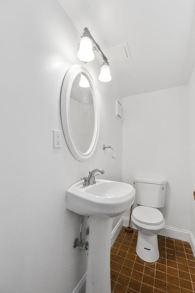 bathroom featuring toilet