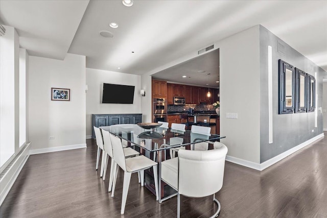 dining room featuring dark wood-type flooring