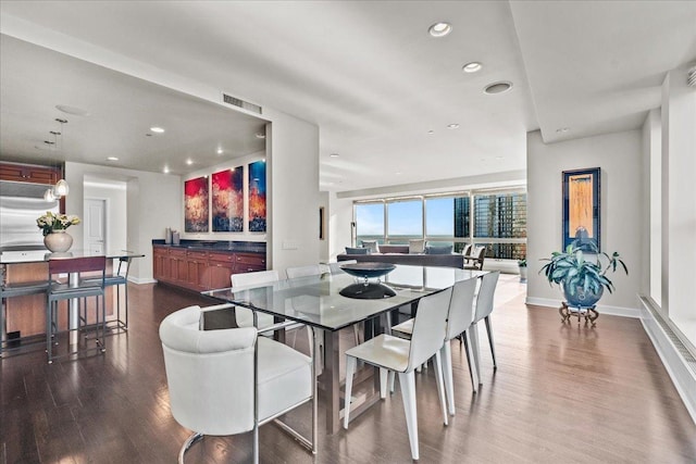 dining room with hardwood / wood-style flooring