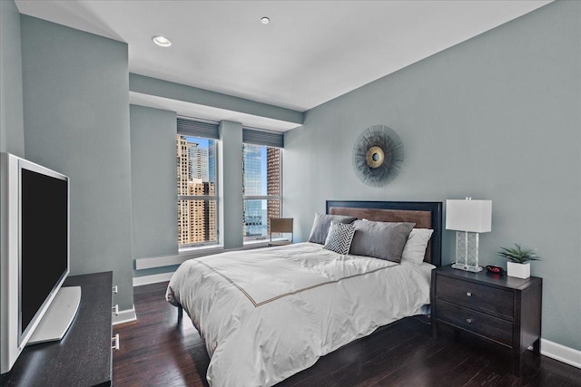 bedroom featuring dark hardwood / wood-style flooring