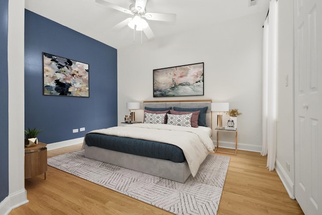 bedroom featuring ceiling fan and hardwood / wood-style floors