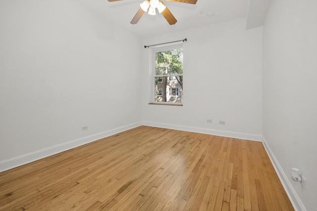 spare room with light hardwood / wood-style flooring and ceiling fan