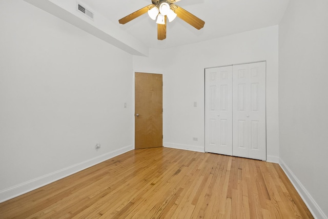 unfurnished bedroom featuring a closet, ceiling fan, and light hardwood / wood-style floors