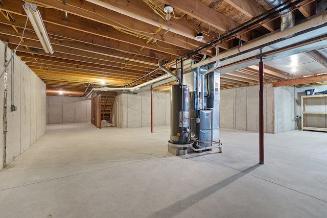 basement with gas water heater and heating unit