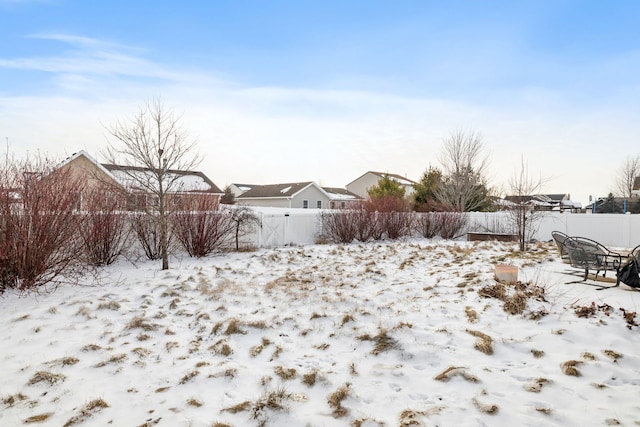 view of yard covered in snow