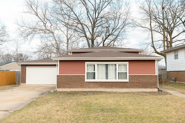 view of front facade with a garage and a front lawn