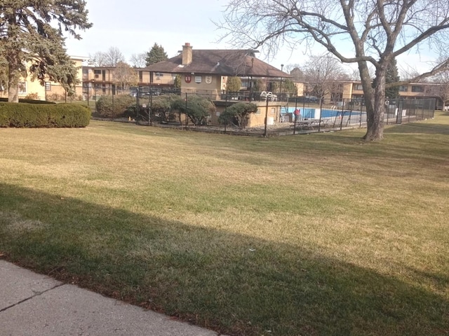 view of yard with a community pool