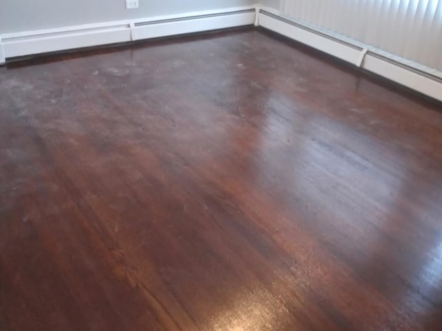 room details featuring hardwood / wood-style flooring and a baseboard heating unit