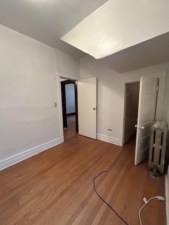 unfurnished room featuring wood-type flooring