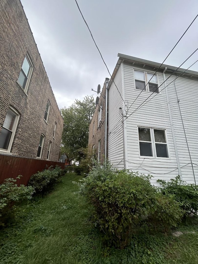 view of home's exterior with a yard