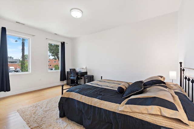 bedroom with light hardwood / wood-style flooring