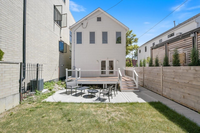 back of property featuring a yard, a patio, a deck, and central air condition unit