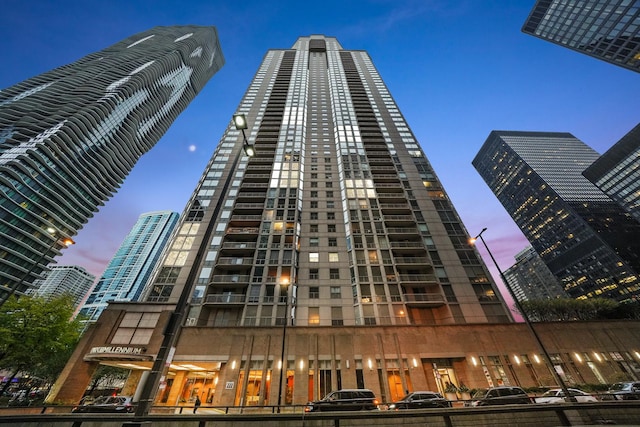 view of outdoor building at dusk