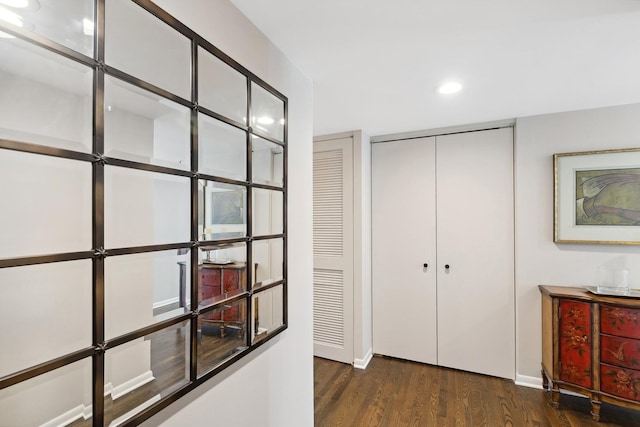 corridor with dark hardwood / wood-style floors