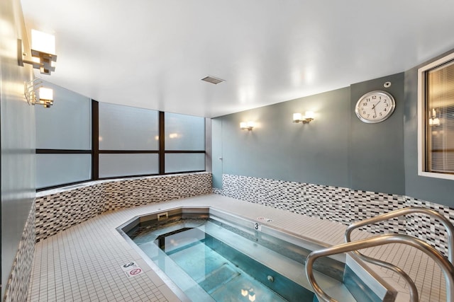 view of pool featuring an indoor hot tub