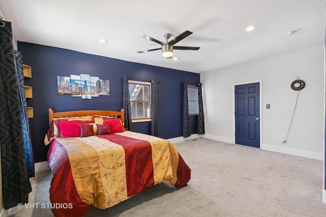 carpeted bedroom with ceiling fan