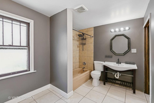 full bathroom with tile patterned flooring, plenty of natural light, and toilet