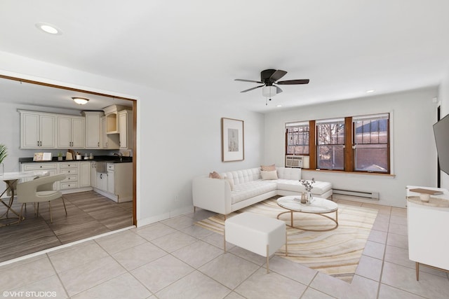 tiled living room featuring ceiling fan and baseboard heating