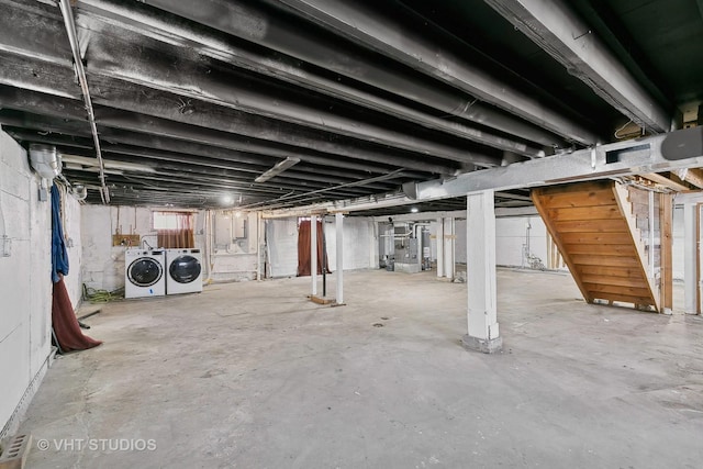 basement with washing machine and clothes dryer