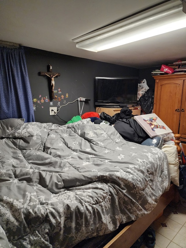 bedroom featuring light tile patterned floors