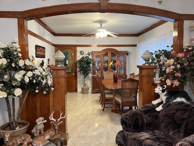 dining room featuring ceiling fan and ornamental molding