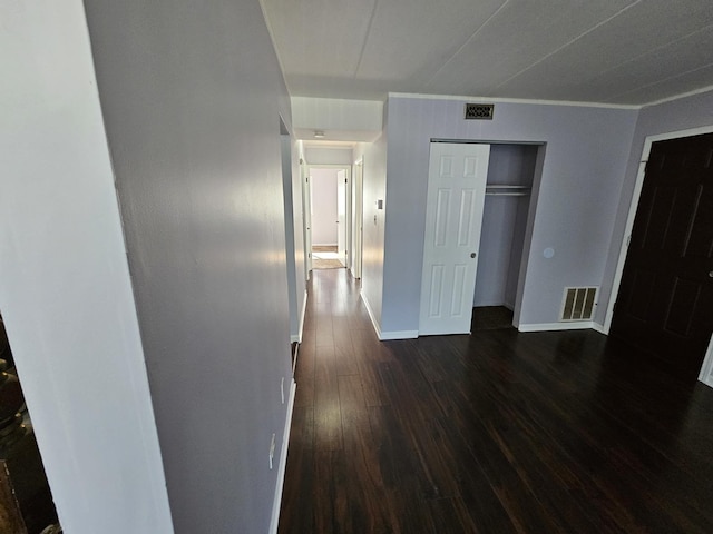 unfurnished bedroom featuring dark hardwood / wood-style floors and a closet